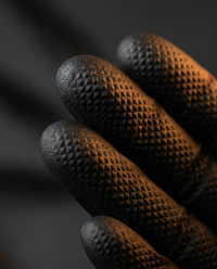 Macro detail of diamond-texture fingertip grip